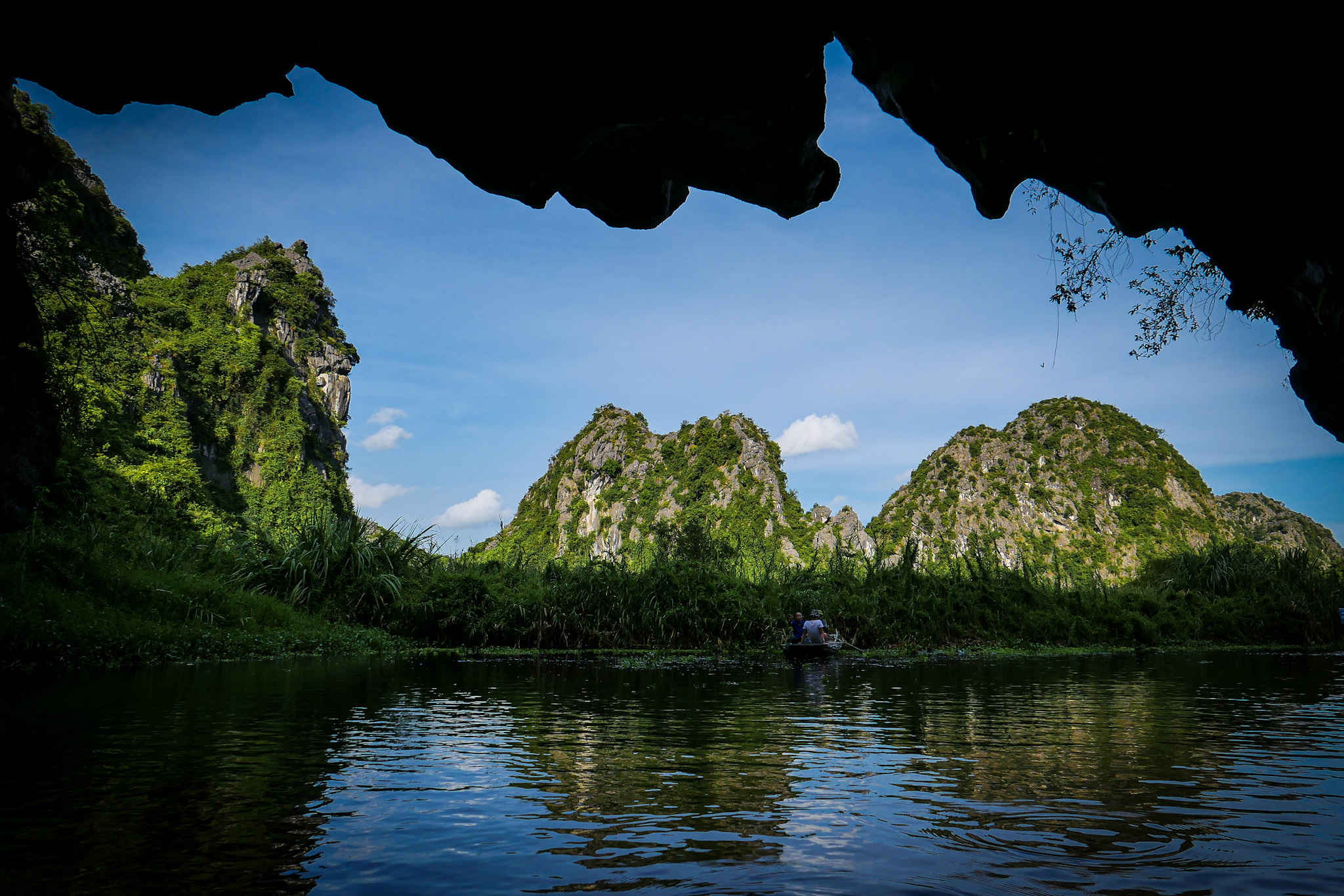 Embark on a traditional hand-rowed sampan in Van Long - Ninh Binh