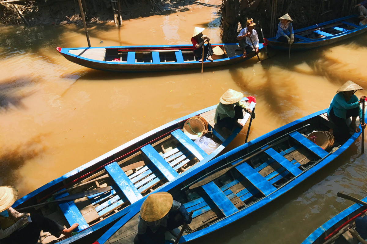 Boats on Mekong delta by Anne Lin