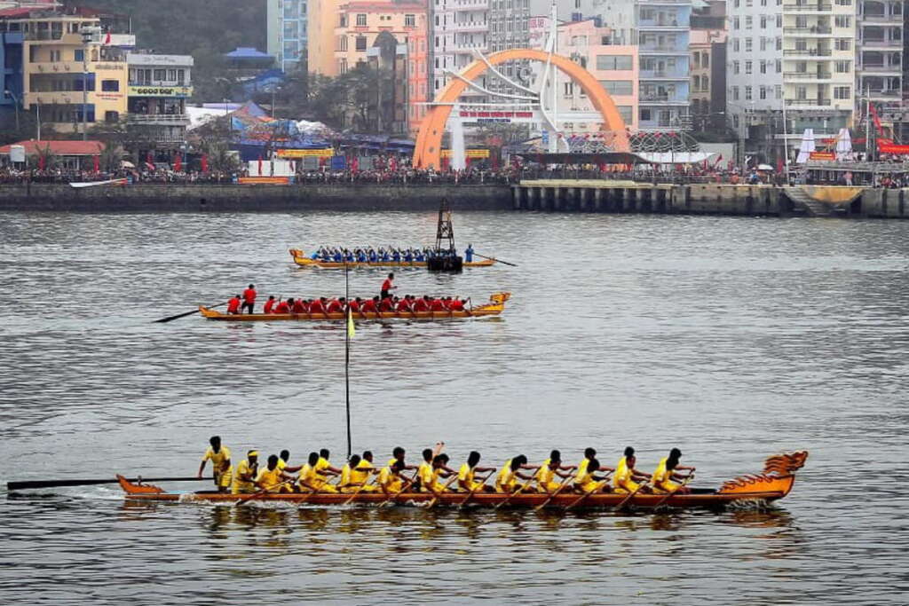 Dragon boat racing in fishermen's village festival in Cat Ba