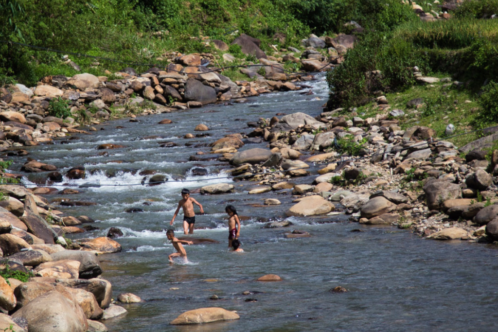 Soak into cool stream with local kids in Vietnam summer